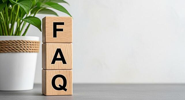 Wooden blocks displaying FAQ in a bright minimalist setting symbolizing readily available information and customer support creating a sense of clarity and helpfulness for website visitors and online u photo