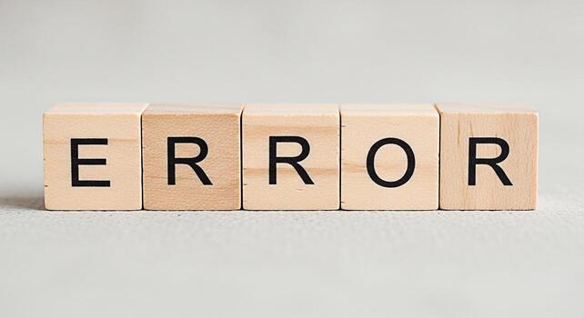 Wooden blocks spelling ERROR on a neutral surface representing a system failure a website problem or a programming bug conveying a sense of frustration and the need for troubleshooting and technical s photo