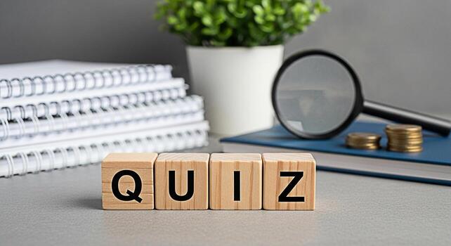 Wooden blocks spelling QUIZ displayed on a gray desk with a magnifying glass and coins symbolizing knowledge assessment and financial literacy in a learning environment fostering curiosity and intelli photo