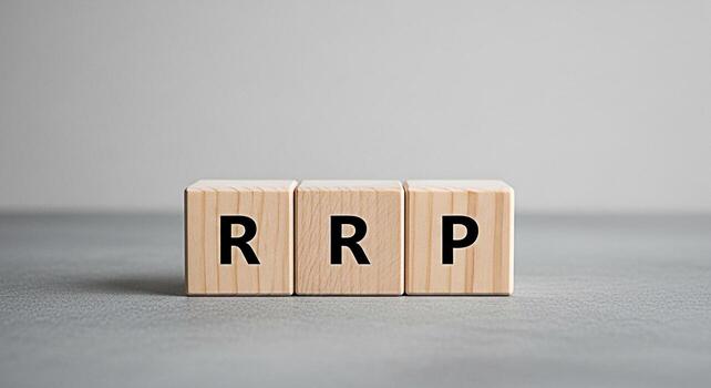Wooden blocks displaying RRP on a gray surface symbolizing retail price strategy and price management in a neutral setting conveying concepts of pricing business and financial planning for retailers photo