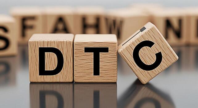 Wooden blocks spelling DTC Direct to Consumer on a reflective surface representing a modern business strategy in a minimalist and clean setting conveying a sense of innovation and direct engagement photo
