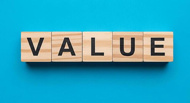 Wooden blocks spelling VALUE on a vibrant blue background representing core values and principles emphasizing importance and worth in business and personal life conveying a sense of integrity and qual photo