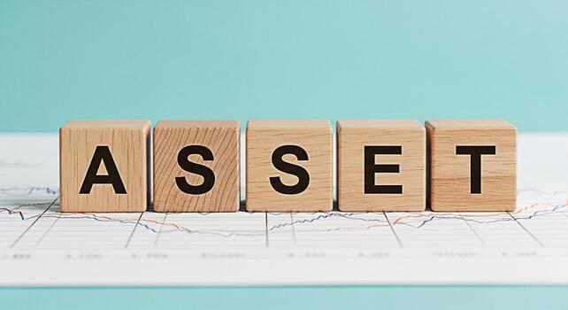 Wooden blocks spelling ASSET on a financial chart symbolizing investment strategy and wealth management in a business context representing financial security and growth potential photo