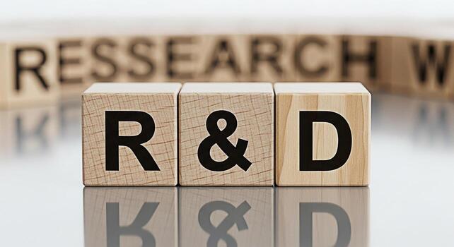 Wooden blocks spelling RD on a reflective surface representing research and development in a corporate environment symbolizing innovation and progress with a clean and modern aesthetic photo