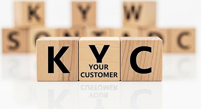 Wooden blocks spelling KYC Know Your Customer on a reflective white surface emphasizing compliance and security in a modern business environment promoting trust and transparency in financial transacti photo