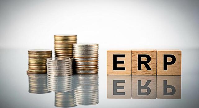 Stacks of coins positioned near wooden blocks displaying the letters ERP on a reflective surface representing enterprise resource planning and financial management conveying a sense of business growth photo