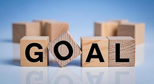 Wooden blocks spelling GOAL on a reflective surface symbolizing aspiration and achievement in a business environment representing ambition motivation and the pursuit of success with a clear focus photo