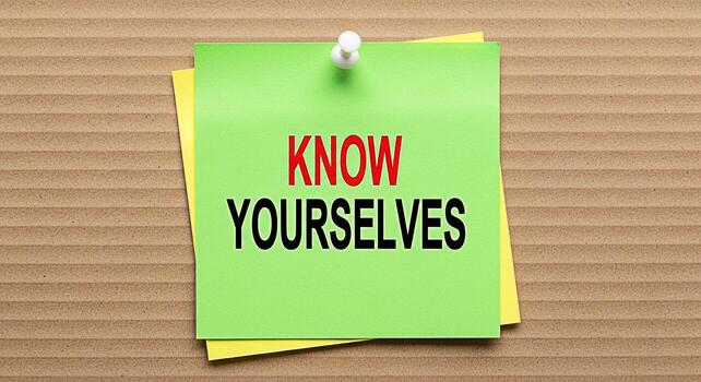 Green sticky note displaying Know Yourselves pinned on a cardboard background encouraging selfawareness and introspection in a simple and direct message for personal growth and understanding photo