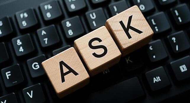 Wooden blocks spelling ASK resting on a black computer keyboard symbolizing information seeking and problemsolving in a modern digital environment fostering curiosity and knowledge acquisition photo