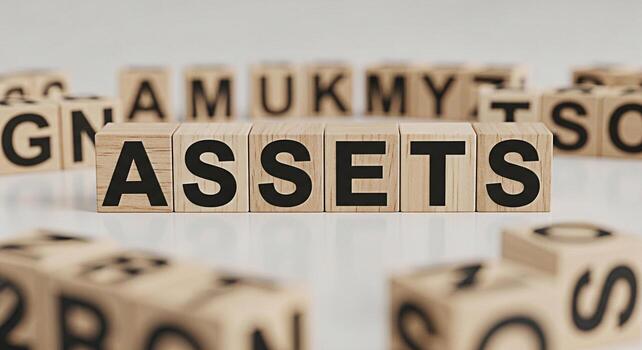 Wooden blocks spelling ASSETS on a white surface representing financial security and wealth management in a clean minimalist setting conveying a sense of stability and growth for investment portfolios photo