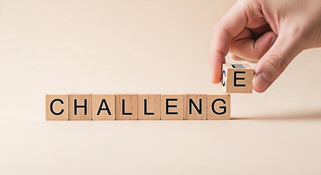 Hand completing Challenge with Change wooden blocks on a neutral background symbolizing overcoming obstacles and embracing transformation with a positive and motivational mindset for personal growth photo