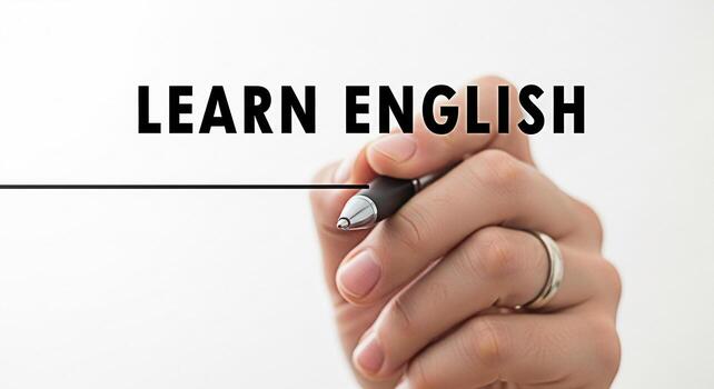 de cerca de un mano participación un bolígrafo subrayando el palabras aprender Inglés en un blanco antecedentes simbolizando educación y idioma adquisición en un limpiar y moderno ajuste foto