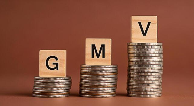 Stacks of coins displaying GMV letters on wooden blocks against a brown background symbolizing growth market value and financial success in a business and investment context with a focus on economic p photo