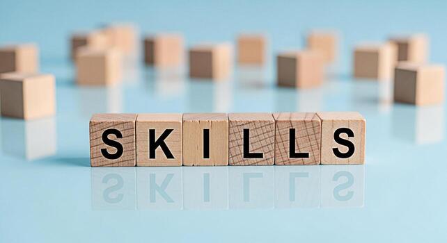 Wooden blocks spelling SKILLS on a reflective blue surface representing learning and development showcasing the concept of acquiring new abilities and expertise for personal and professional growth photo