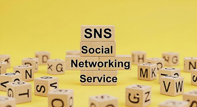 Wooden blocks displaying SNS Social Networking Service on a vibrant yellow background symbolizing connection communication and the importance of online platforms in todays digital age fostering a sens photo