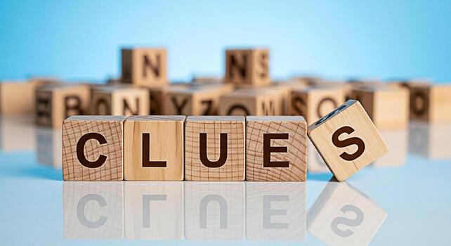 Wooden blocks spelling CLUES on a reflective surface suggesting mystery and investigation in a bright minimalist setting perfect for illustrating problemsolving and analytical thinking concepts photo