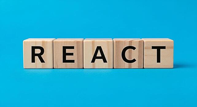 de madera bloques ortografía reaccionar desplegado en un vibrante azul antecedentes representando un moderno y atractivo Acercarse a web desarrollo y usuario interfaz diseño con un atención en innovación y creatividad foto