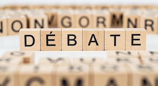 Wooden blocks spelling Dbat on a white surface representing a formal discussion and exchange of opposing views creating a sense of intellectual challenge and critical thinking in a neutral environment photo