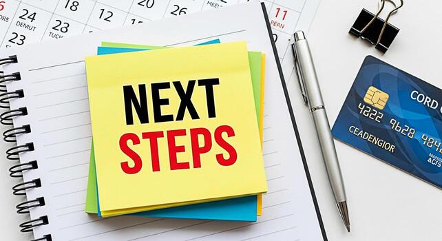 Closeup of a notepad displaying Next Steps with a pen and credit card on a white desk symbolizing planning and financial strategy for future business growth and success in a modern office environment photo