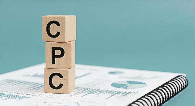 Wooden blocks displaying CPC on a financial report symbolizing cost per click advertising strategy in a business setting highlighting datadriven marketing and campaign optimization for online success photo