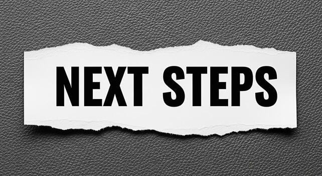 Bold Next Steps text on a torn white paper against a textured gray background symbolizing progress planning and a proactive approach to achieving goals in business and personal development conveying a photo