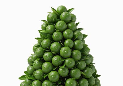 Fresh green limes and leaves forming a decorative conical topiary structure photo