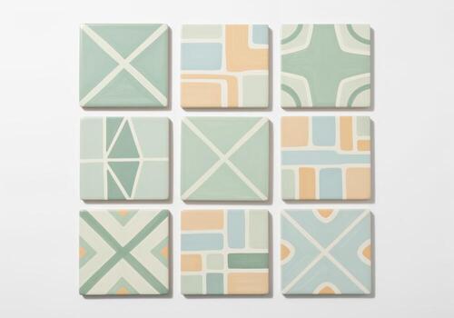 Nine square artisanal ceramic tiles with unique hand painted geometric pastel patterns photo