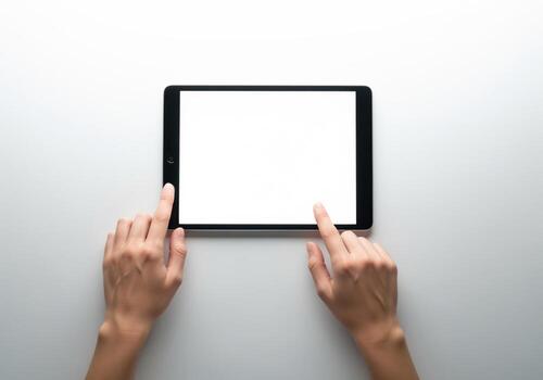 Woman hands touching blank white screen of digital tablet device on clean white background photo