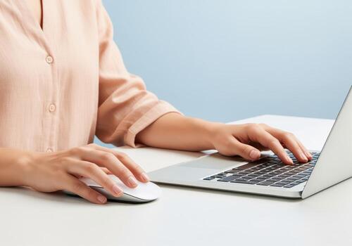 Professional woman hands typing on laptop and using mouse for remote work. photo