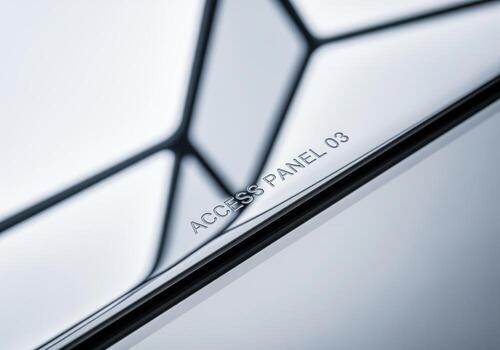 High gloss polished stainless steel access panel detail with abstract geometric reflection photo