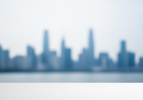 Abstract blurred city skyline background above a clean white table display surface photo
