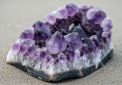 Raw violet amethyst crystal geode cluster showcasing jagged points and texture photo