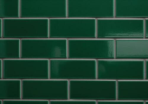 High gloss dark emerald green rectangular ceramic subway tile pattern. photo