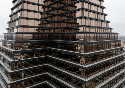 Stepped geometric facade of a modern corporate skyscraper with reflective bronze glass windows photo
