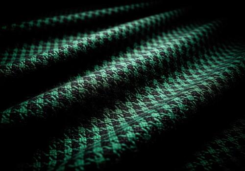 Luxurious dark emerald green and black houndstooth wool fabric texture closeup photo