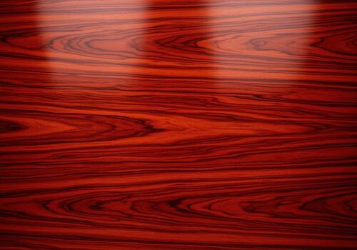 Highly polished deep cherry wood veneer texture with complex swirling grain pattern and glossy reflection photo