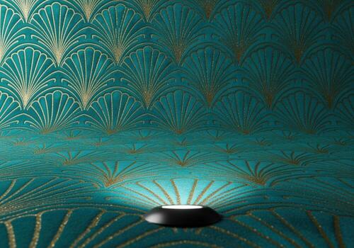 Luxurious teal velvet art deco fan pattern background illuminated by a spotlight. photo