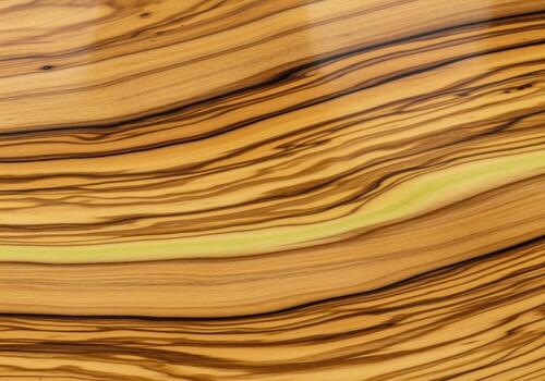 Highly polished exotic olive wood texture background with natural swirling grain pattern photo