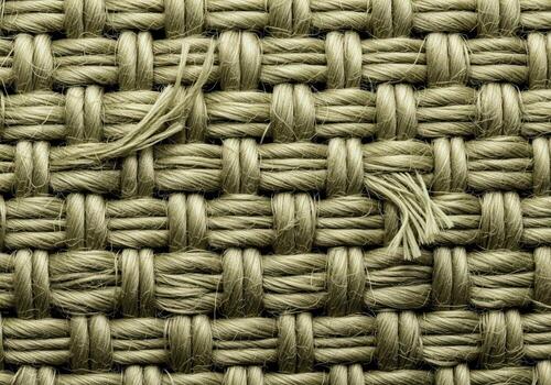 Macro photograph of tightly woven coarse burlap fabric texture in earthy olive green color photo