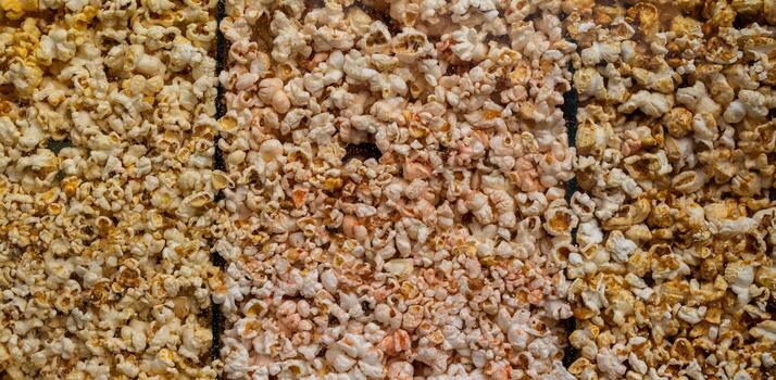 Popcorn background. Popcorn texture. Popcorn texture background. Hundreds popcorns background. High resolution, clean macro image. photo