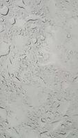 Rain splatter patterns on glass dynamic movement of water droplets in highresolution closeup sequence video