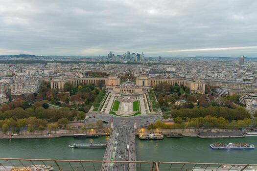 Night view of Paris from the Eiffel Tower with illuminated buildings and a transitional sky photo