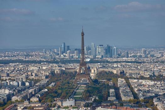 Panoramic view of Paris with the Eiffel Tower in the foreground and the La Defense district in the background from the Montparnasse Tower photo
