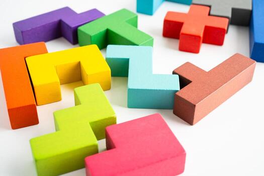 Logical thinking problem solving creative business solution concept, wooden puzzle geometric shape block shape. photo