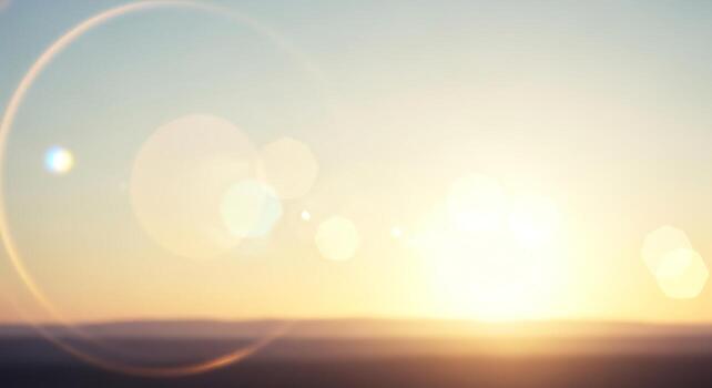 Sunlight illuminating a serene horizon with a soft lens flare effect, creating a peaceful atmosphere photo
