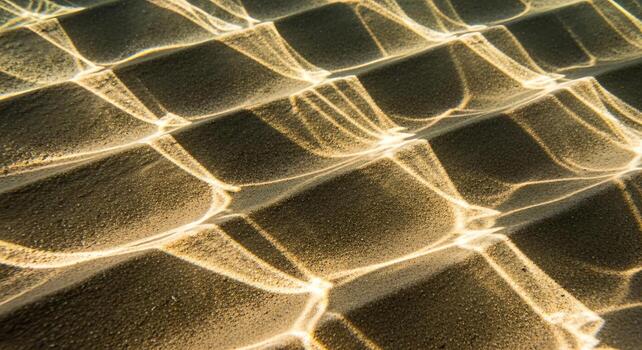 Sunlight reflecting on rippled water creating a captivating abstract pattern of light and shadow photo