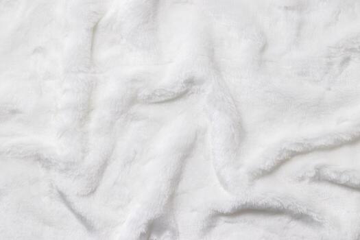 White Faux Fur Textures, Soft, white artificial fur with fluffy texture and gentle shadows. Close-up textile background delicate textures, top view, copyspace, backdrop with soft folds photo