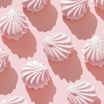 Pink marshmallow meringues zephyr pattern on soft pastel Pink Background, Top view of swirled zephyr sweet dessert with shadow, minimal aesthetic layout, romance food, valentines day food photo