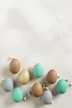 Easter Composition with Pastel Eggs and Spring Blossoms, still life Dyed eggs in soft pastel colors, top view spring holiday minimal creative pattern, neutral earth colored image, above photo