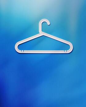 One White Clothes hanger as creative minimal composition on vivid blue gradient background, Plastic rack creating modern and minimal aesthetic, top view, flat lay creative photo, copyspace photo